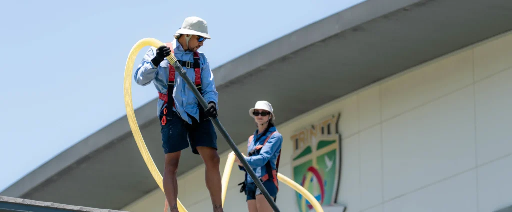 Team conducting a gutter cleaning job